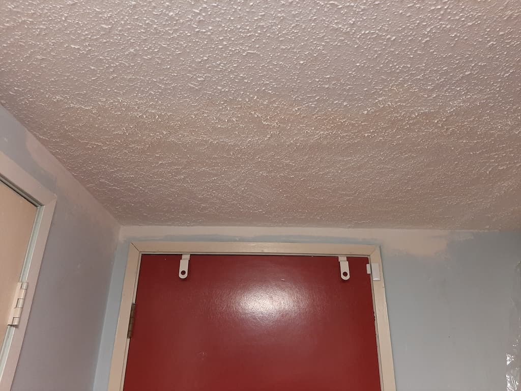 Ceiling repair after texture match, ready for painting