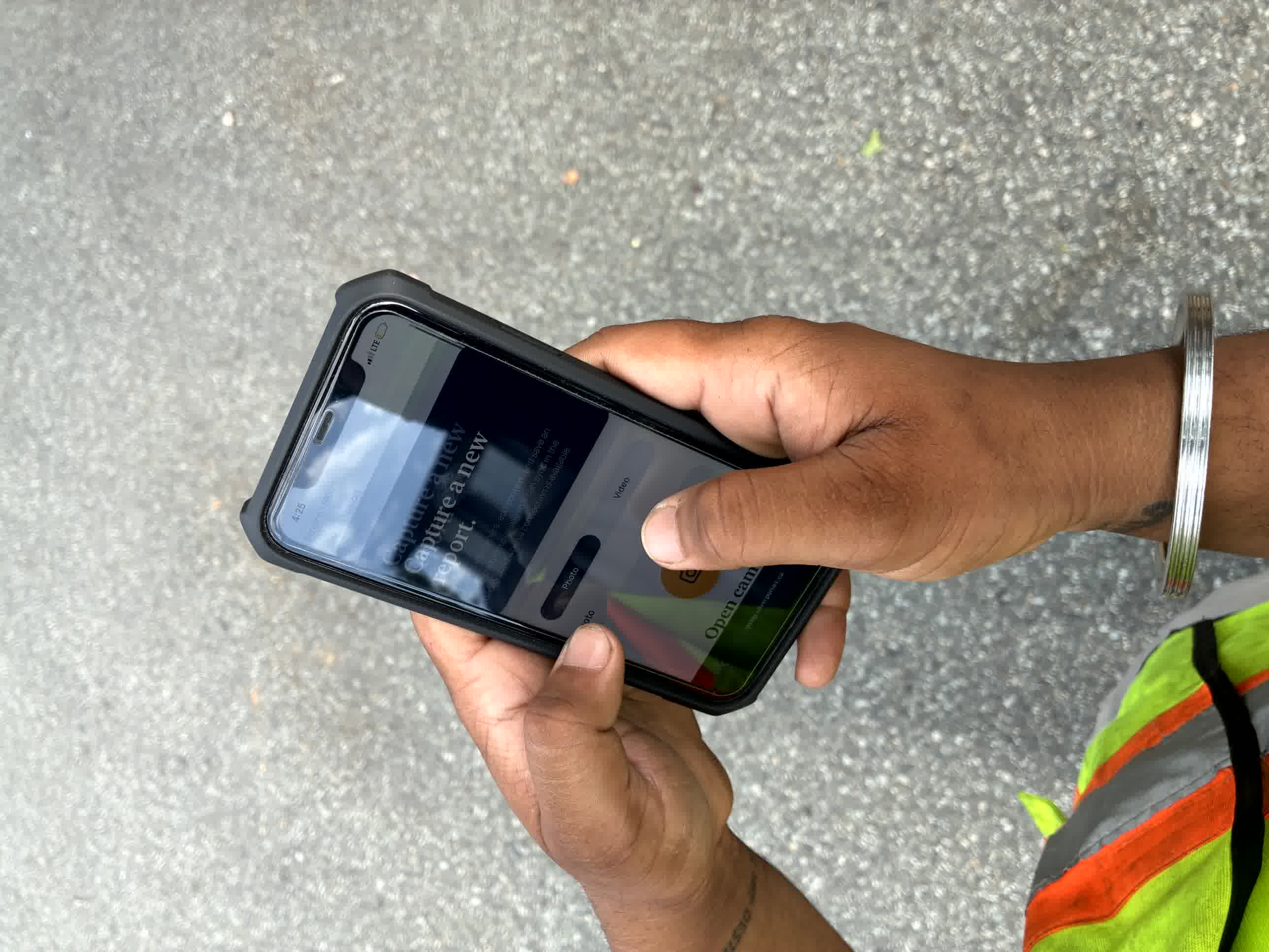 Construction worker using the How’s It Going app to capture a site report